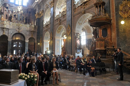 Finalists of the “Face of the City” award, members of the Lviv City Council and of the Chamber of Commerce  and clergy sit in the 17th century Church of Saint Peter and Paul,  waiting for the announcement of the winners by Volodymyr Korud, Head of the City Councils Department of International Relations.