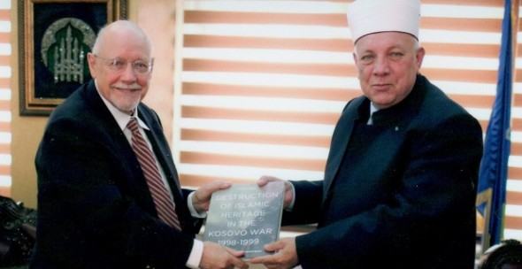 Resul Rexhepi, (R) Secretary of the Kosovo Islamic Community, shows Rabbi Bemporad a historical marker acknowledging destruction of Islamic heritage in the Kosovo war.